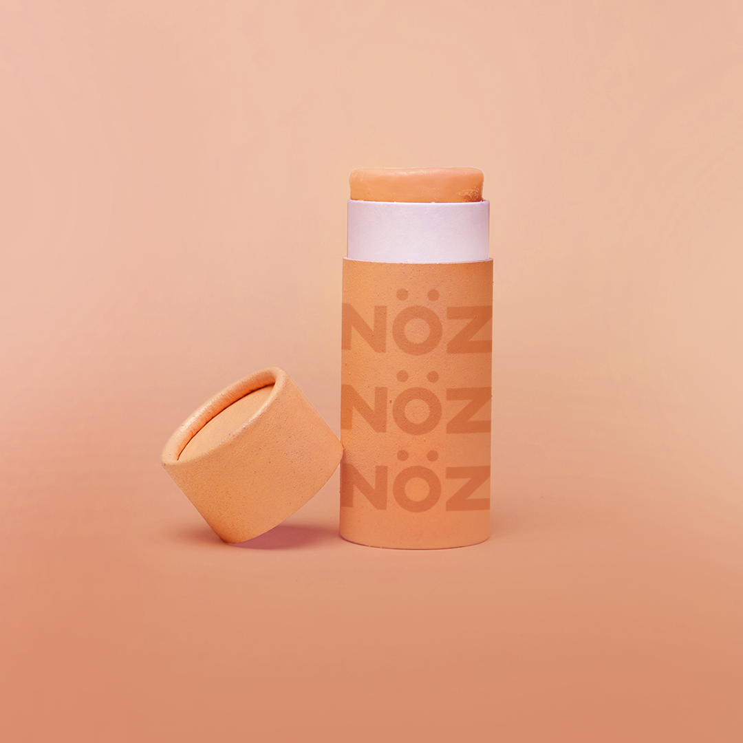 Sunfire Orange colored Nöz Sunscreen in stick applicator form, available in SPF 30, 50, and 70. Reef safe, eco-friendly, and fun!