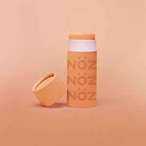 Sunfire Orange colored Nöz Sunscreen in stick applicator form, available in SPF 30, 50, and 70. Reef safe, eco-friendly, and fun!